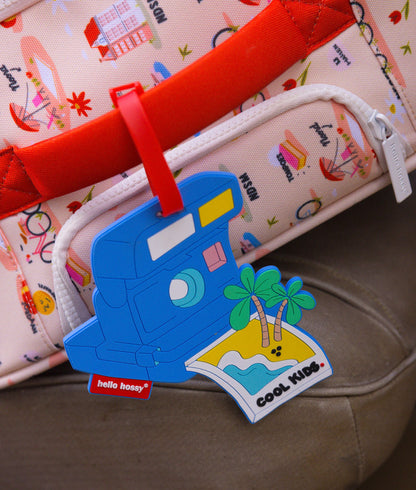 Etichetta per valigia per bambini blu con motivo macchina fotografica e isola Hello Hossy