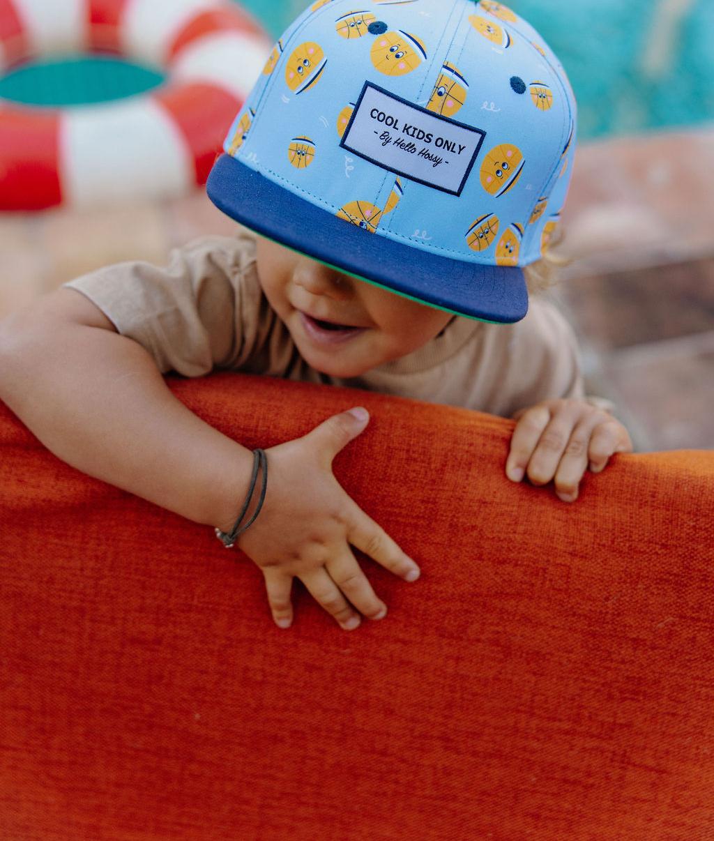 Cappellino bambino stampato palloncini gialli visiera blu marine Hello Hossy