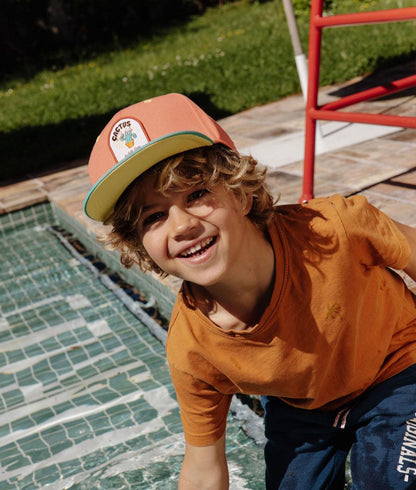 Cappellino bambino arancione con patch cactus e visiera piatta Hello Hossy