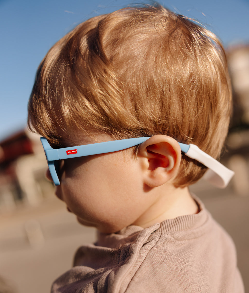 Occhiali da sole per bambini blu con montatura spessa e attacco posteriore Hello Hossy
