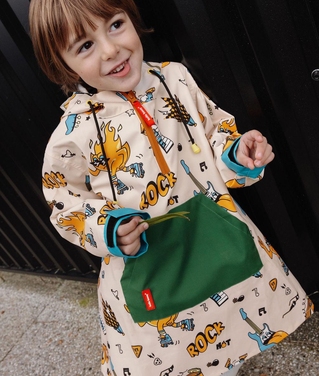 Poncho antipioggia bambino crema, motivi musica, tasca verde Hello Hossy