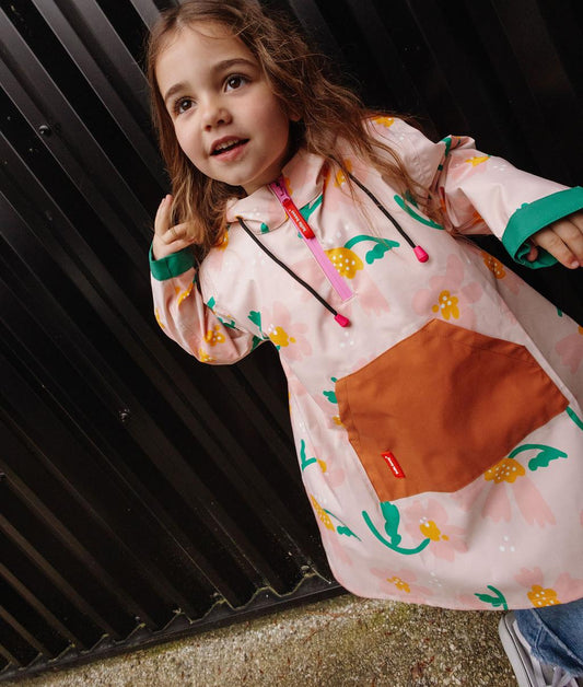 Poncho antipioggia bambino rosa stampato a fiori, tasca cammello Hello Hossy