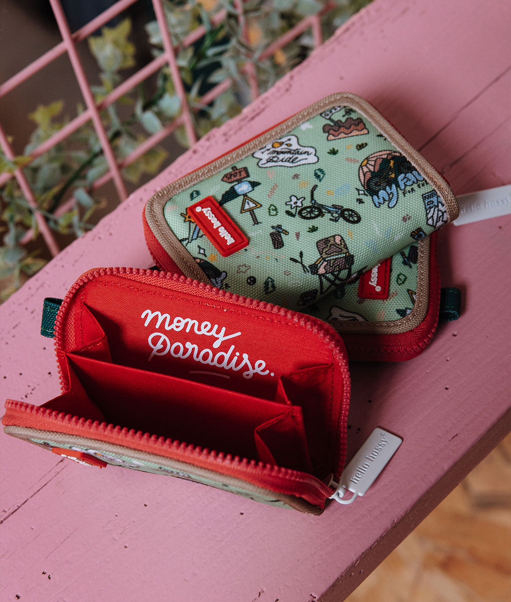 Portamonete bambino verde con motivo viaggio in bicicletta profilo beige e interno rosso Hello Hossy
