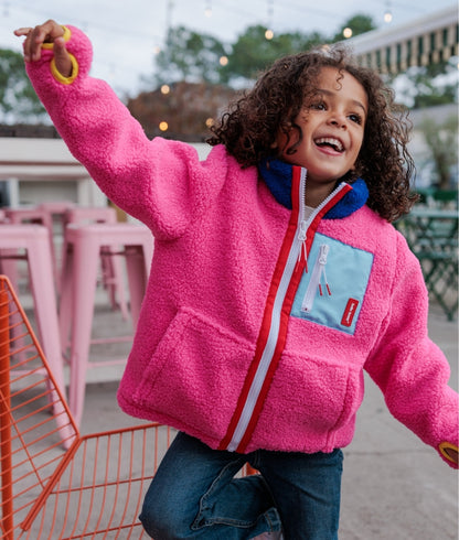 Giacca in pile da bambino fuchsia con tasca blu con zip Hello Hossy