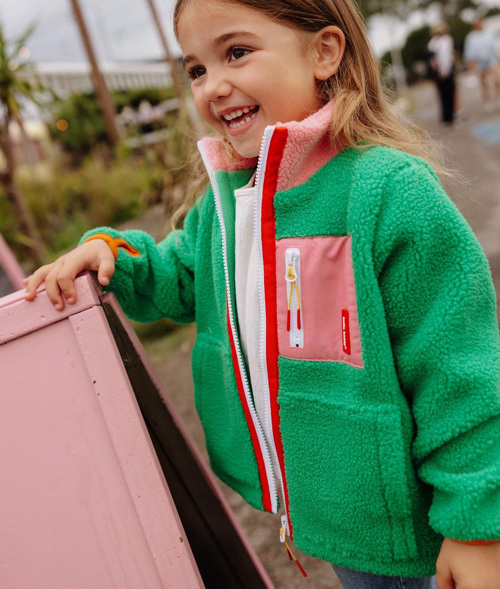 Giacca in pile bambino verde e rosa vista di profilo Hello Hossy