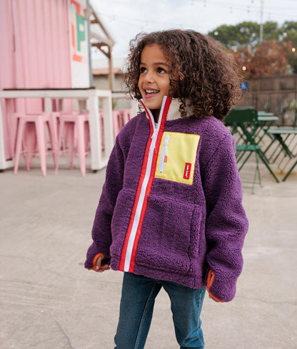 Giacca in pile bambino prune con tasca gialla, zip arancione Hello Hossy